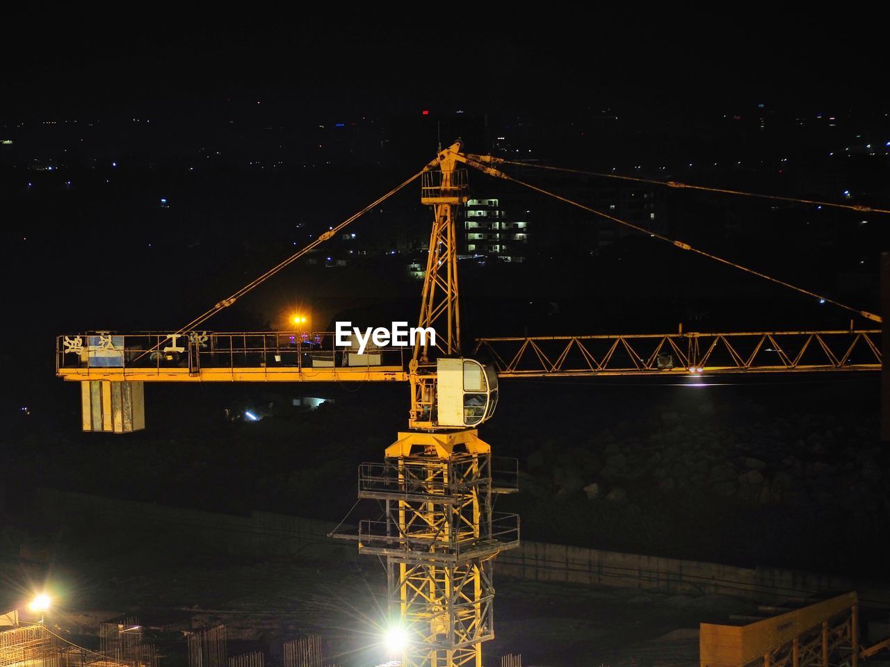 Low angle view of illuminated bridge against sky at night