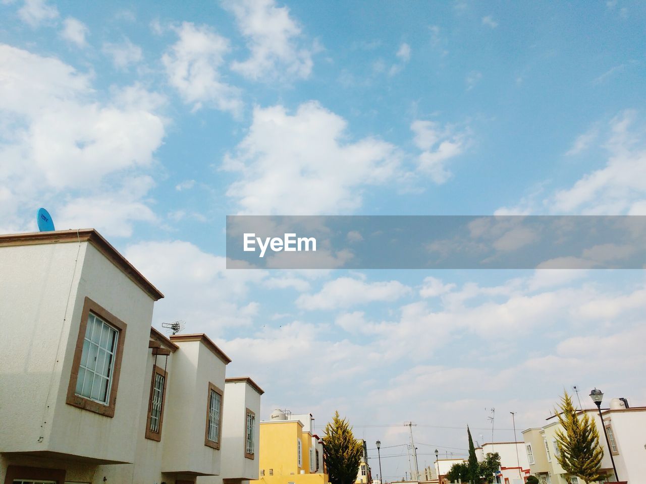 HOUSES AGAINST SKY