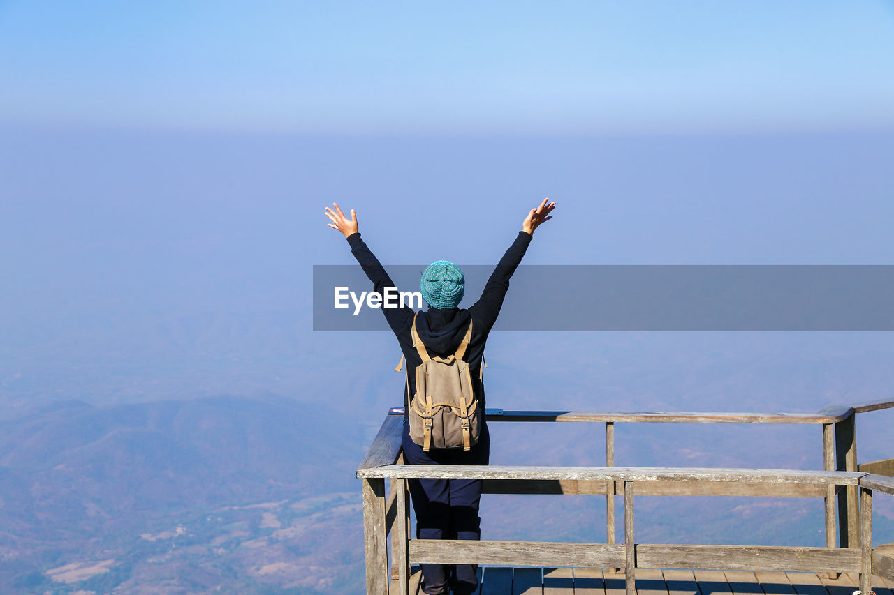 Rear view of woman standing at observation point