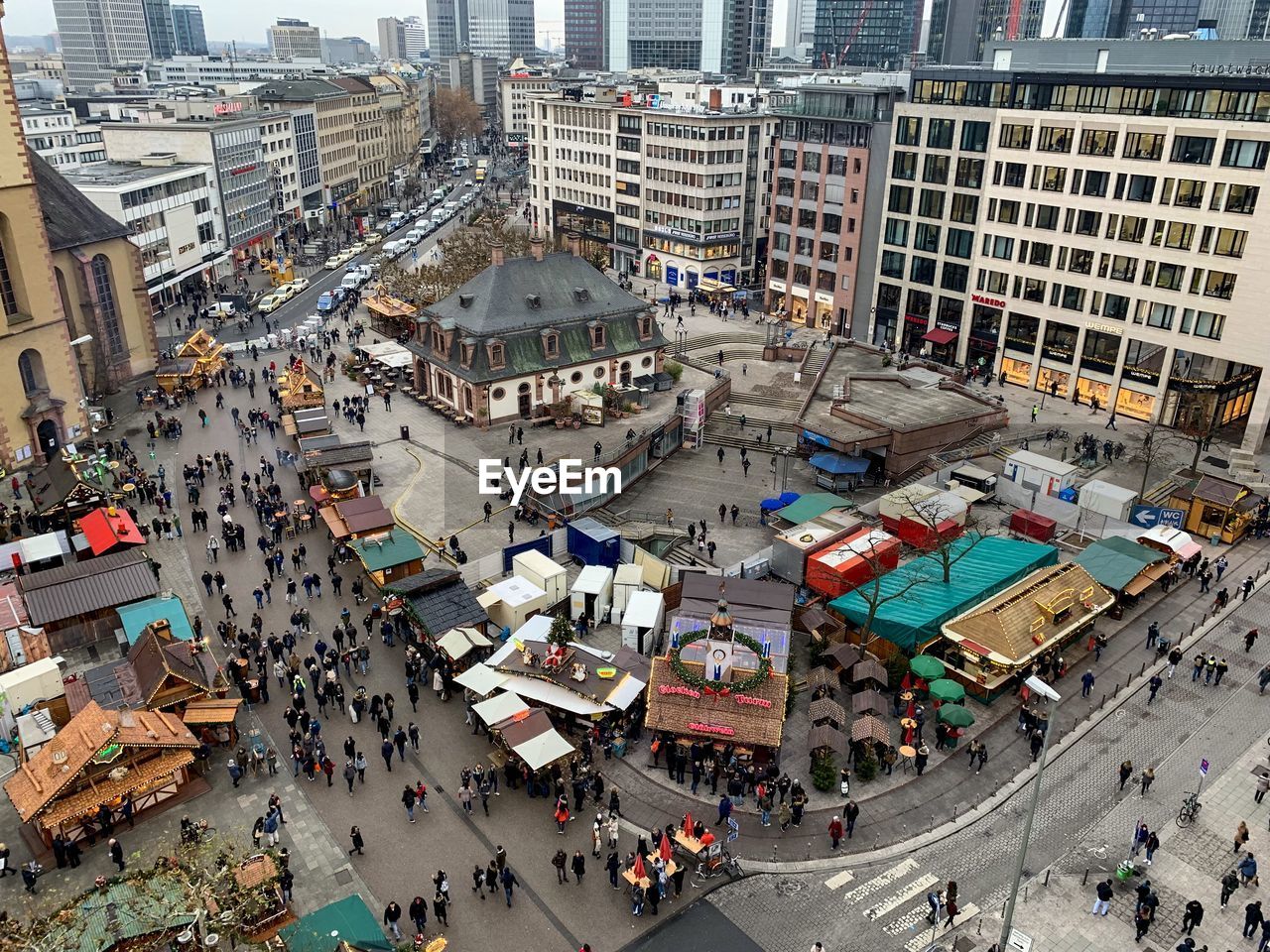 High angle view of people walking on city street