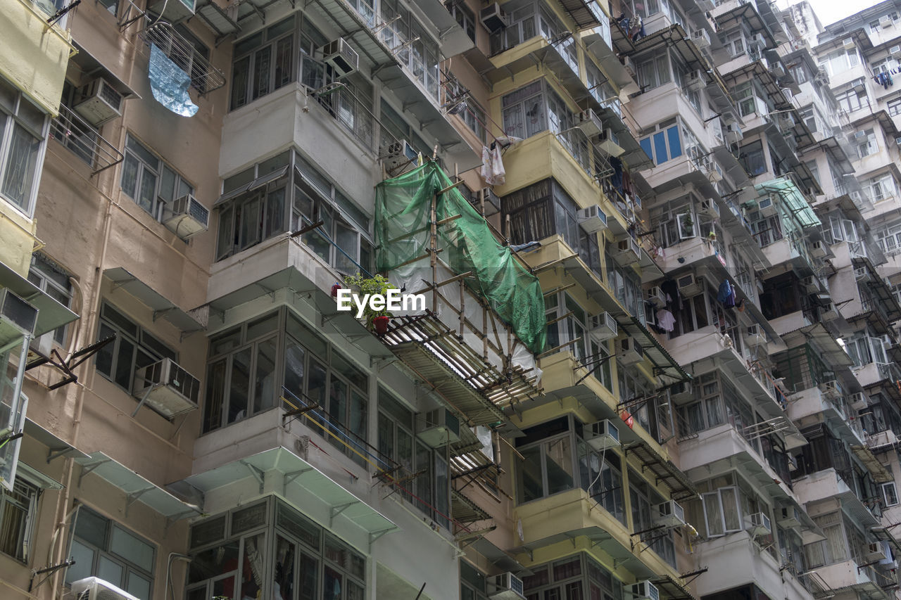 Low angle view of buildings in city, hong kong