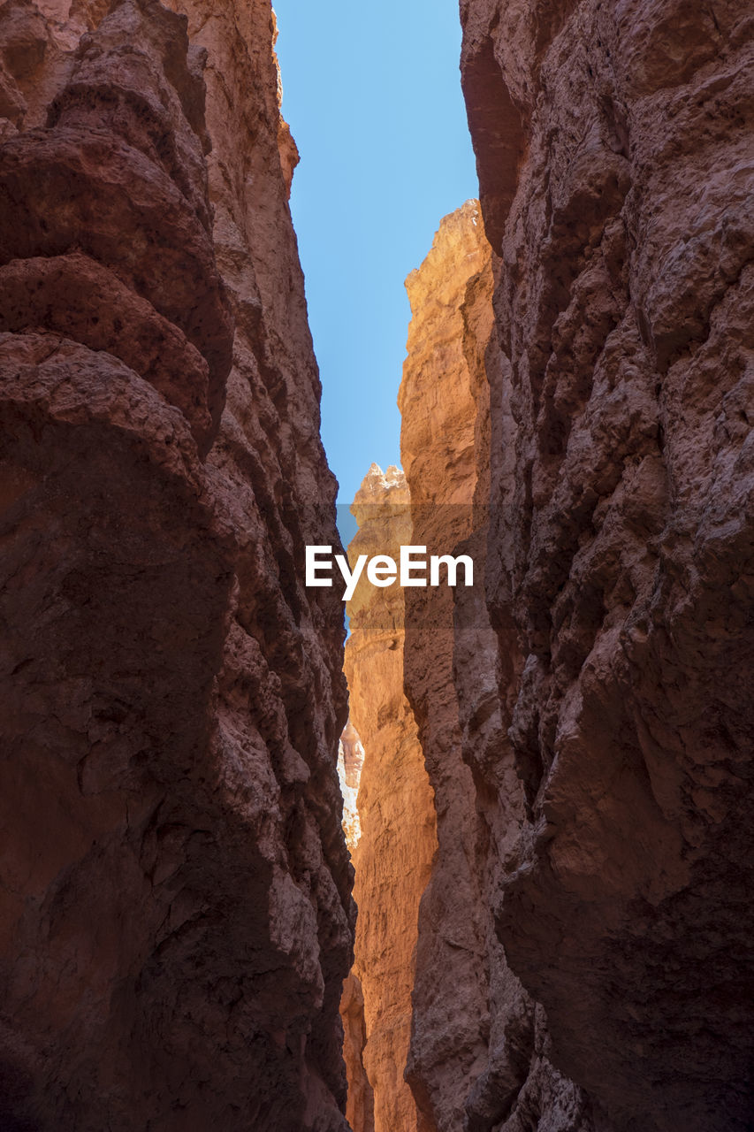 Looking through a partially lit canyon