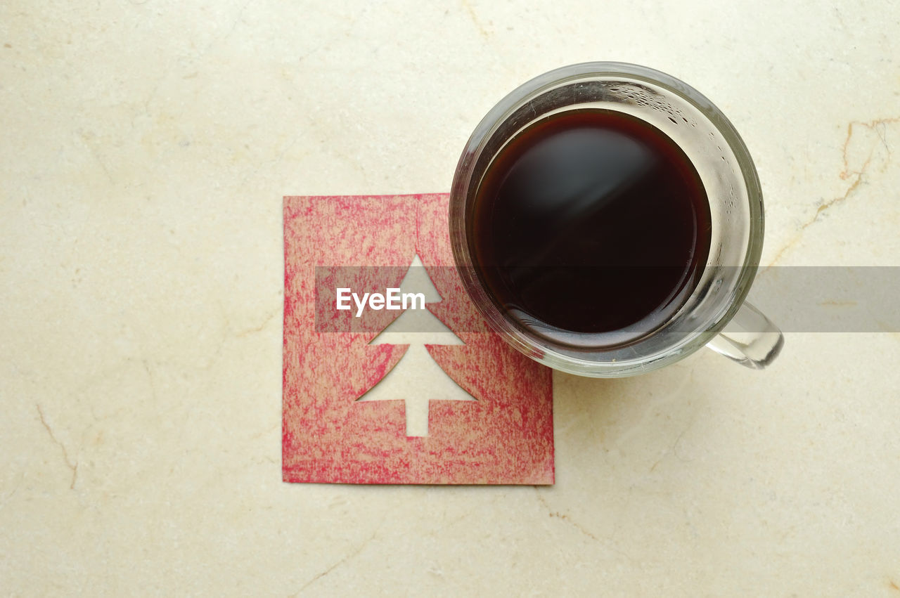 CLOSE-UP OF COFFEE ON TABLE