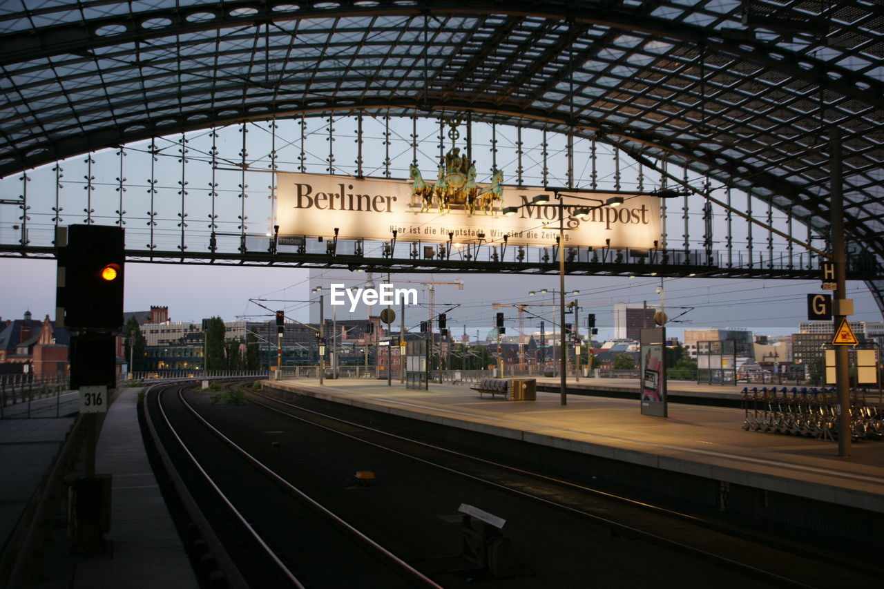 TRAIN ON RAILROAD STATION PLATFORM