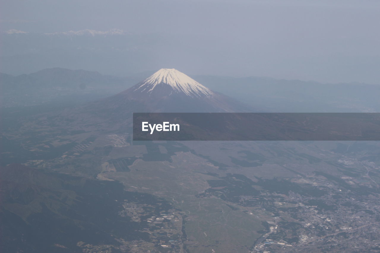 Aerial view of volcanic landscape against sky