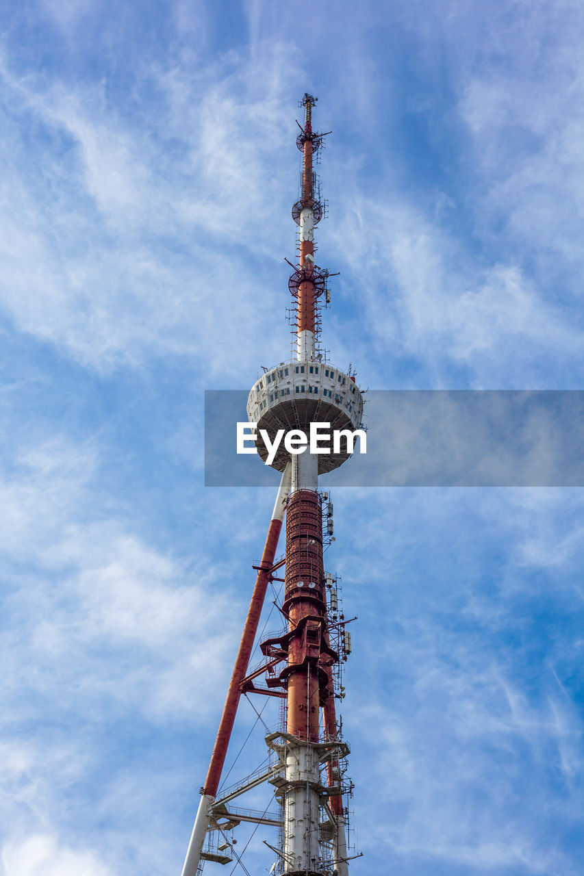 LOW ANGLE VIEW OF TOWER AGAINST CLOUDY SKY