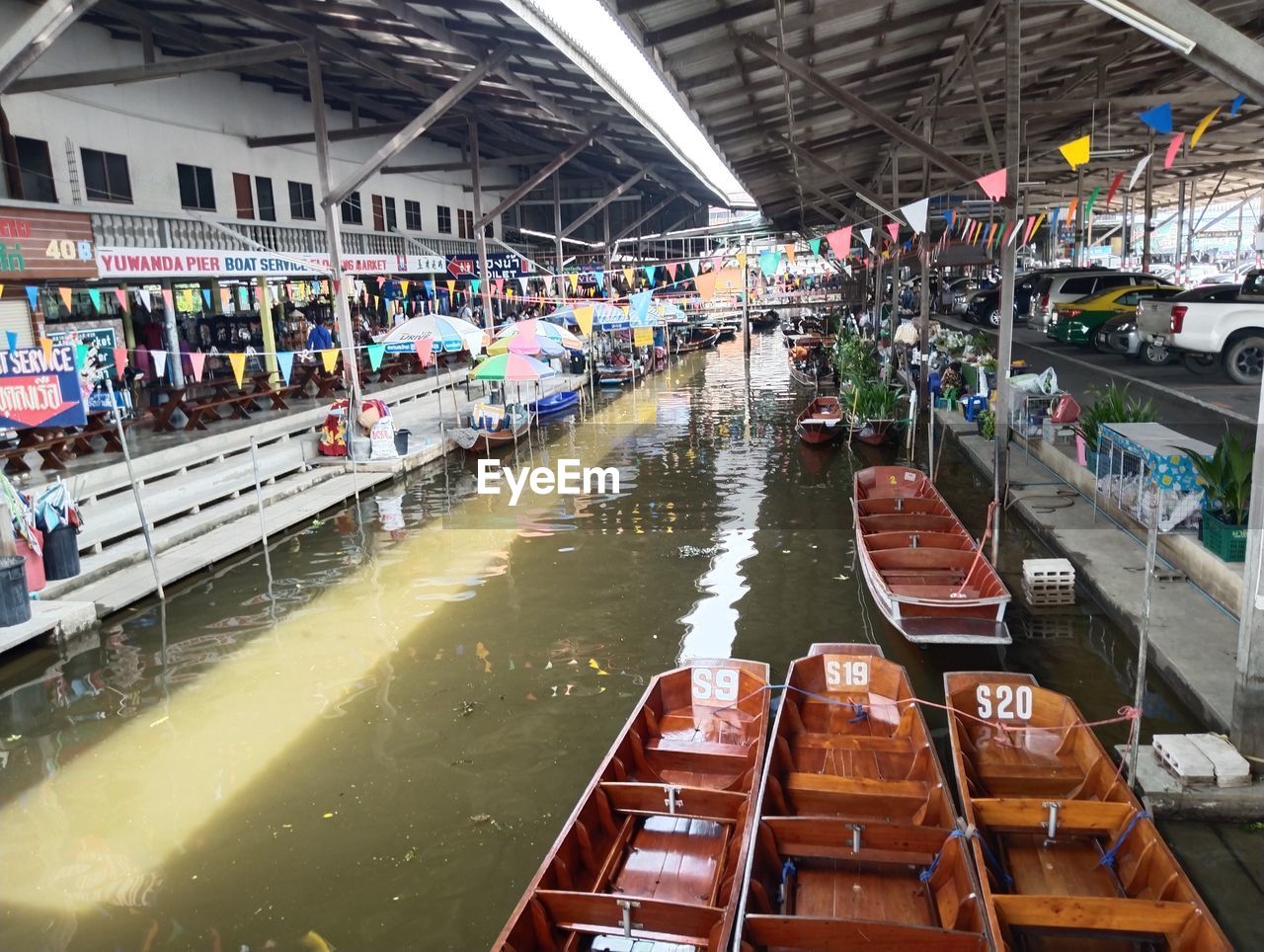 transportation, architecture, vehicle, water, mode of transportation, built structure, nautical vessel, crowd, transport, indoors, large group of people, group of people, travel, day, in a row