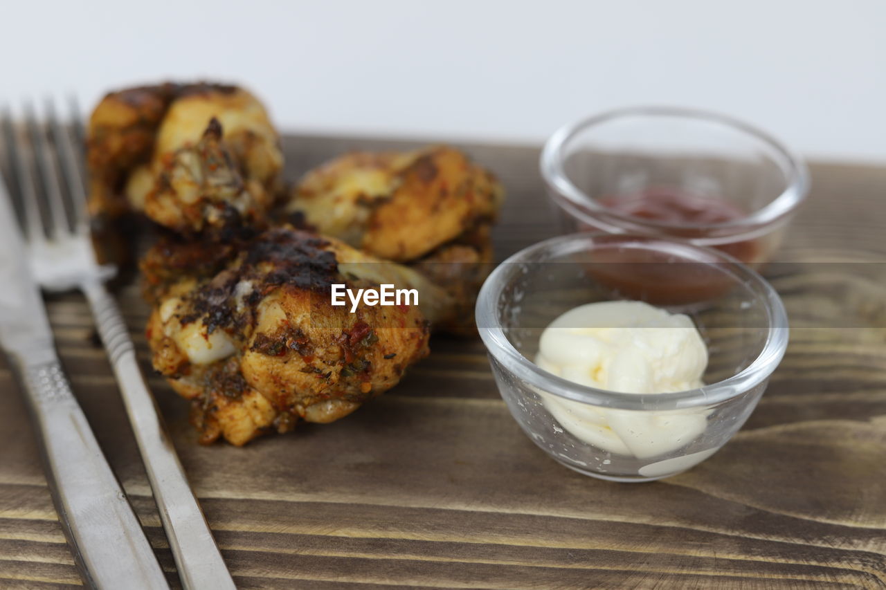 food and drink, food, dish, breakfast, freshness, dessert, healthy eating, produce, meal, wellbeing, no people, baked, indoors, studio shot, wood, eating utensil, fried food, kitchen utensil, close-up, household equipment, meat, cuisine, focus on foreground, table, vegetable