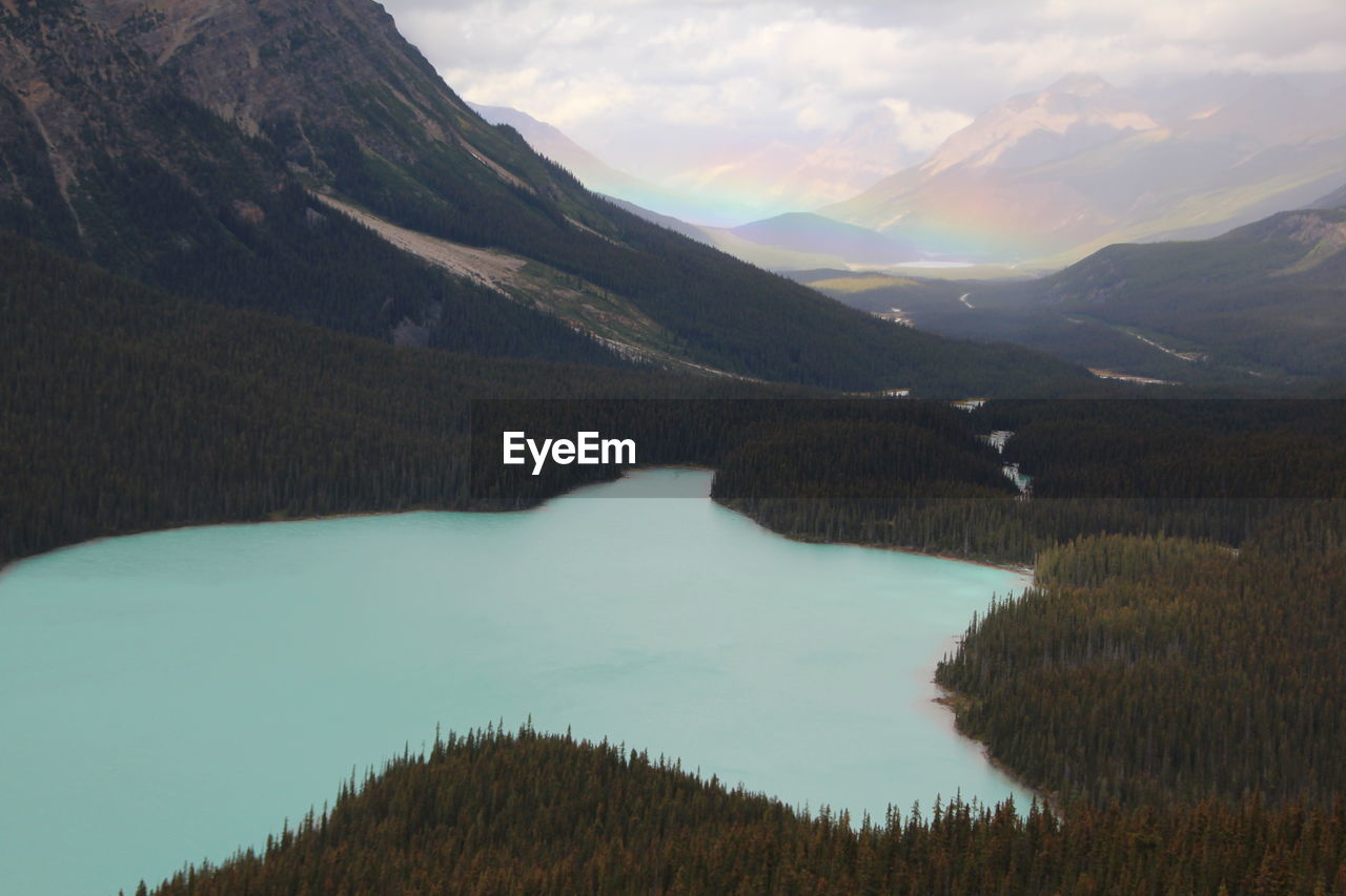 Scenic view of lake and mountains against sky