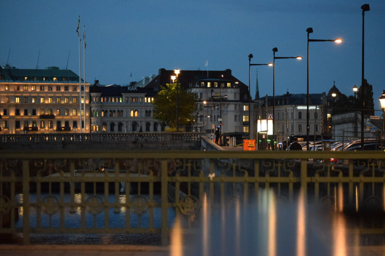 architecture, built structure, reflection, evening, cityscape, building exterior, water, city, night, dusk, illuminated, landmark, sky, urban area, travel destinations, building, nature, street light, skyline, street, river, downtown, waterway, bridge, no people, travel, transportation, tourism, lighting equipment, outdoors, waterfront, city life, history, clear sky, the past, government