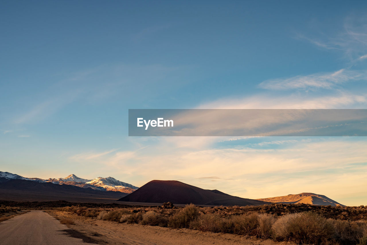 Scenic view of desert against sky during sunset