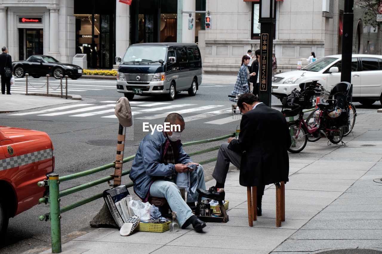 MAN RIDING BICYCLE ON STREET