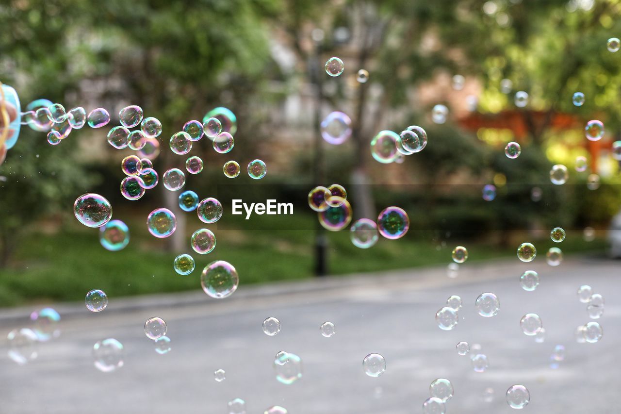 CLOSE-UP OF WATER DROPS IN BUBBLES