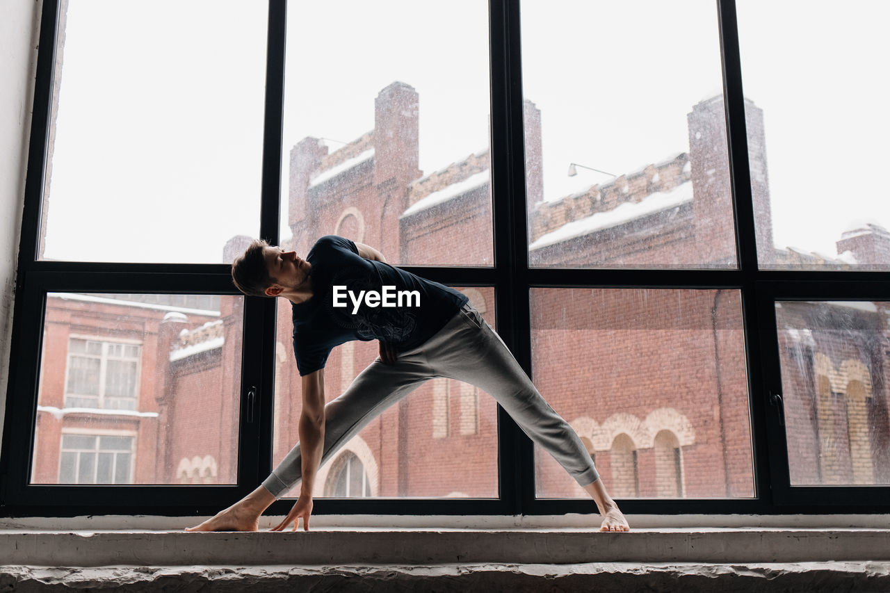 A man engaged in yoga and meditation, performing asanas