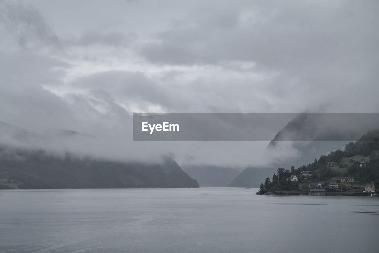 VIEW OF SEA AGAINST CLOUDY SKY