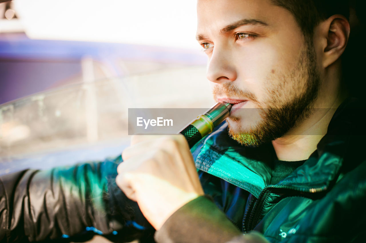 Man smoking electronic cigarette