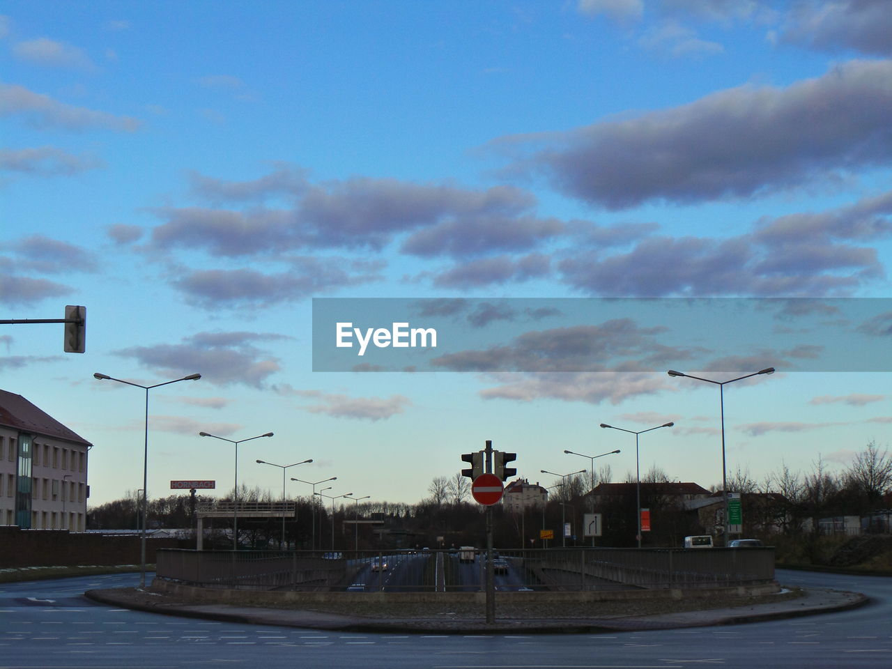 VIEW OF CLOUDY SKY OVER ROAD