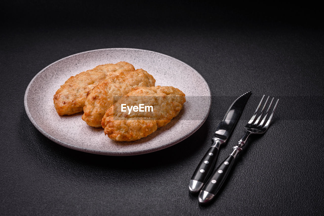 high angle view of food in plate on black background