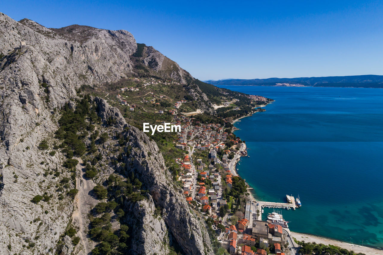 scenic view of sea and mountains against sky