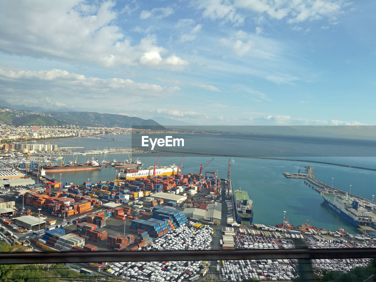 HIGH ANGLE VIEW OF SHIP MOORED AT HARBOR