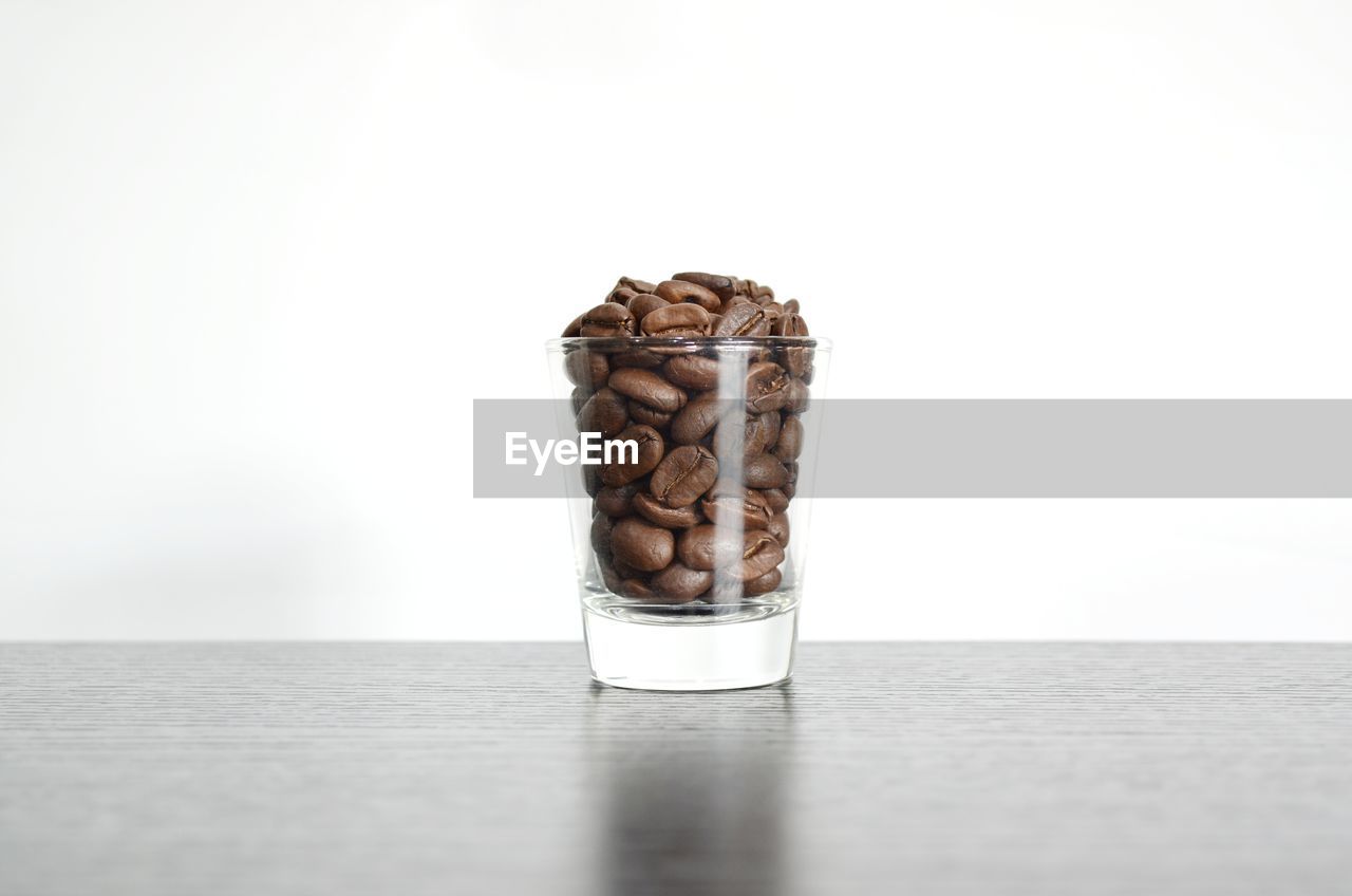 CLOSE-UP OF COFFEE CUP ON TABLE