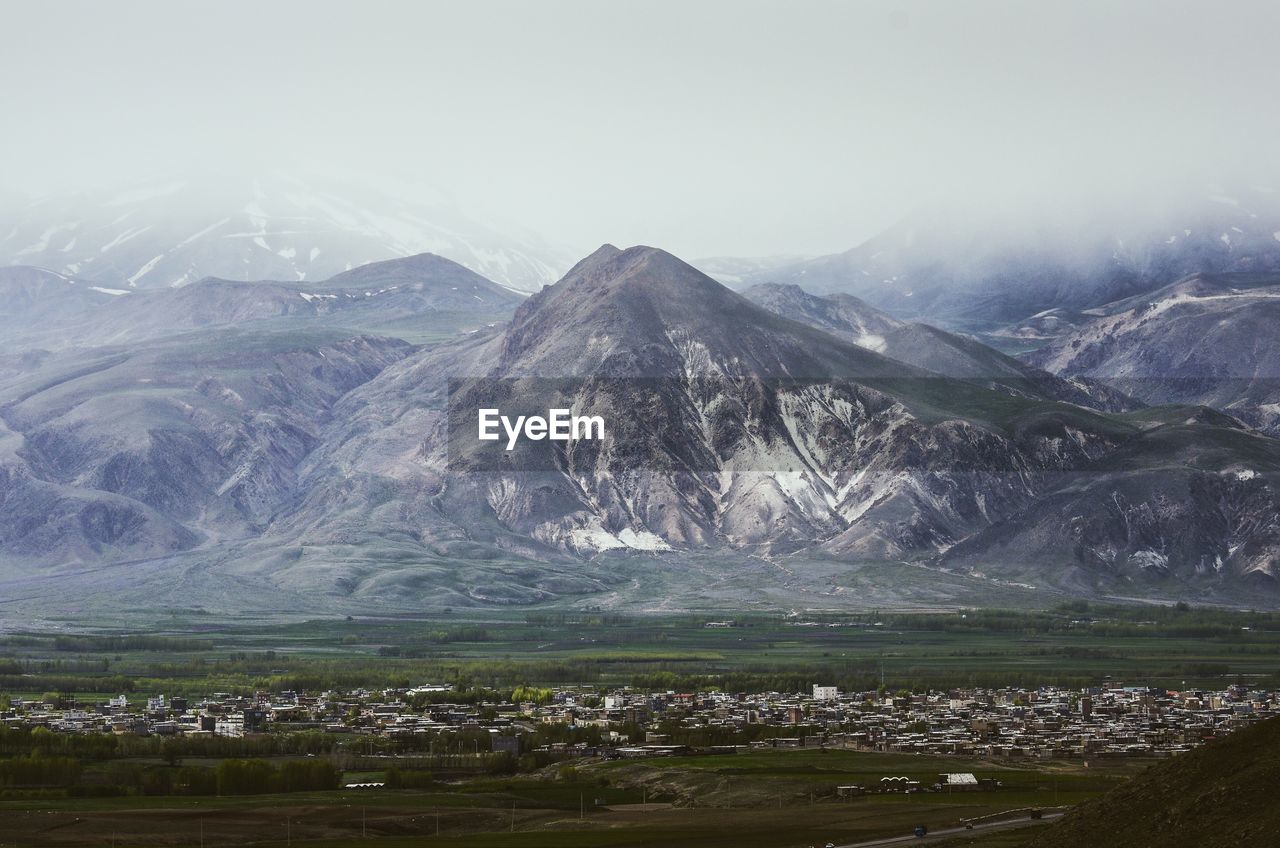 Scenic view of snowcapped mountains against sky