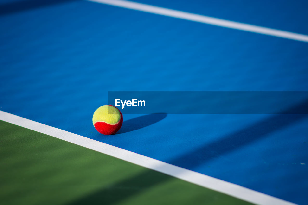 Close-up of ball on tennis court