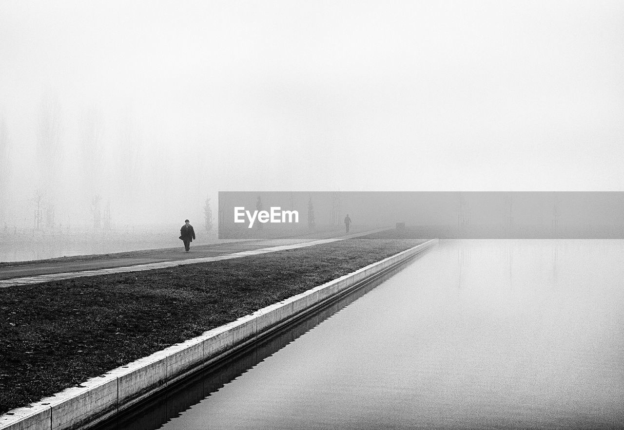 SCENIC VIEW OF FOGGY WEATHER AGAINST SKY DURING WINTER