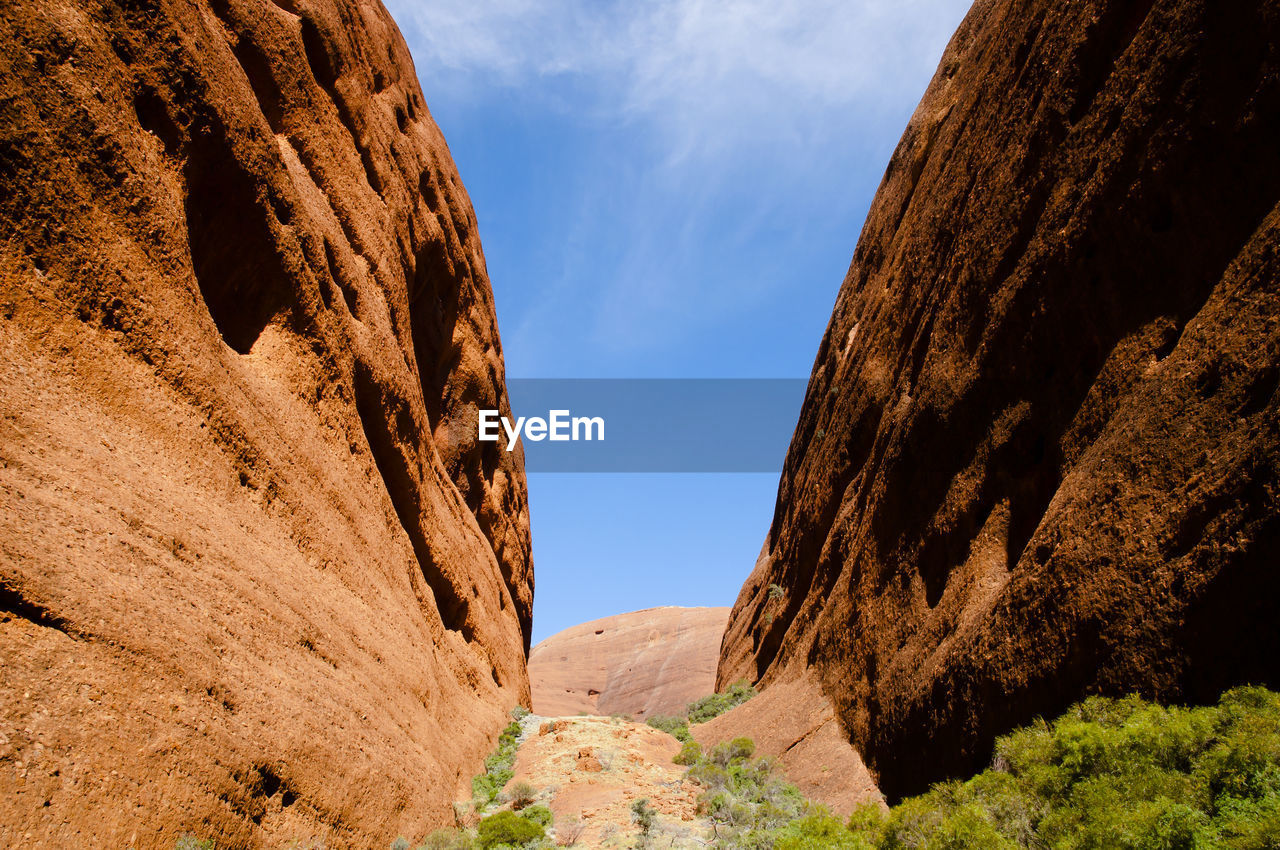 Low angle view of rock formation against sky