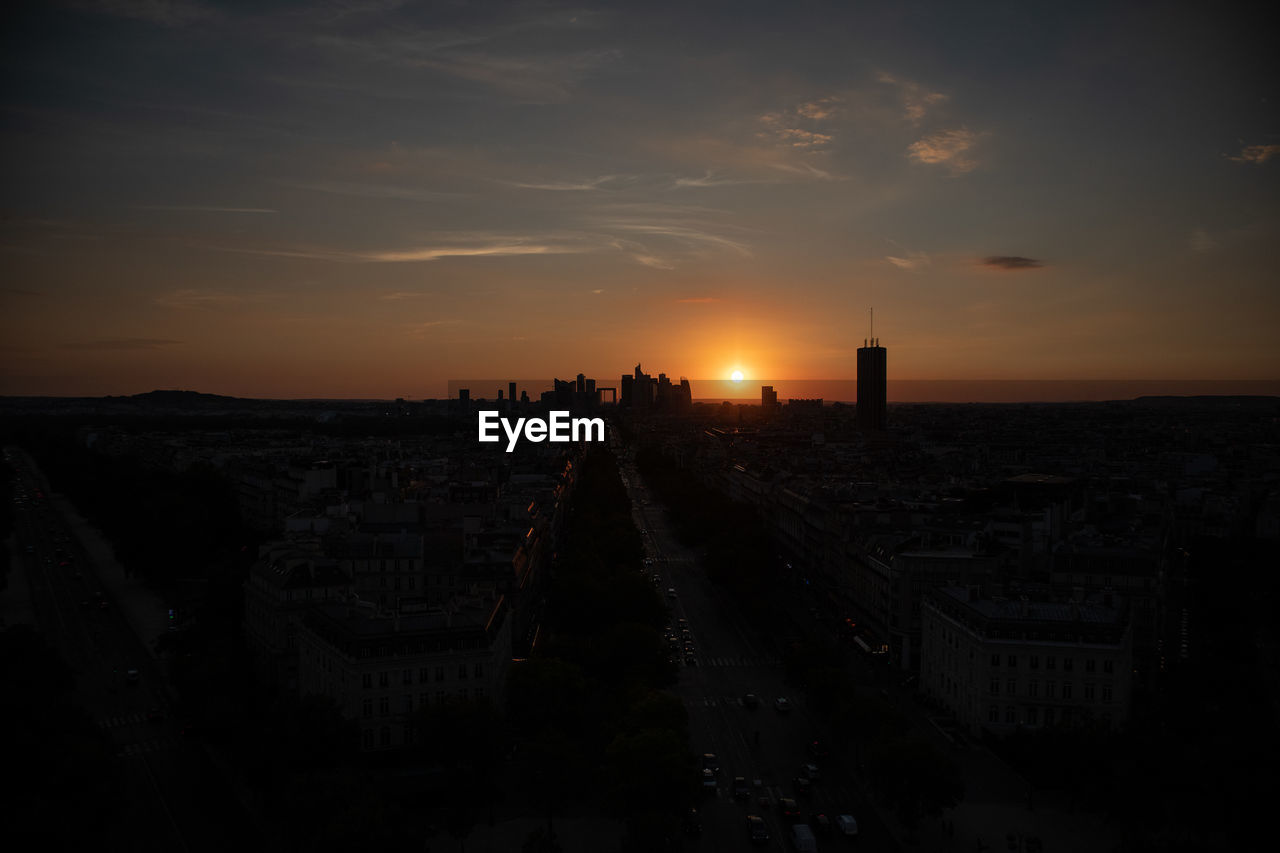 High angle view of illuminated buildings against sky during sunset