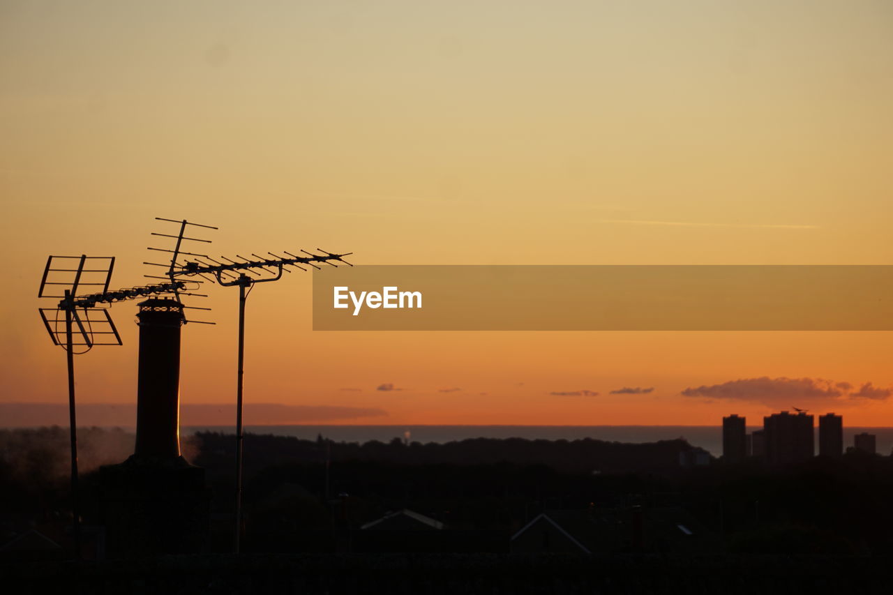 low angle view of silhouette trees against sky during sunset