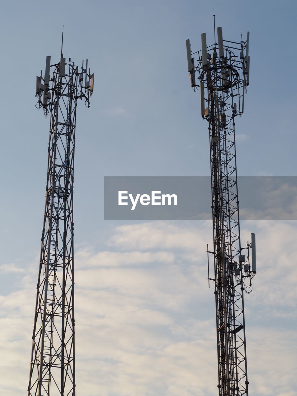 Low angle view of communications tower against sky