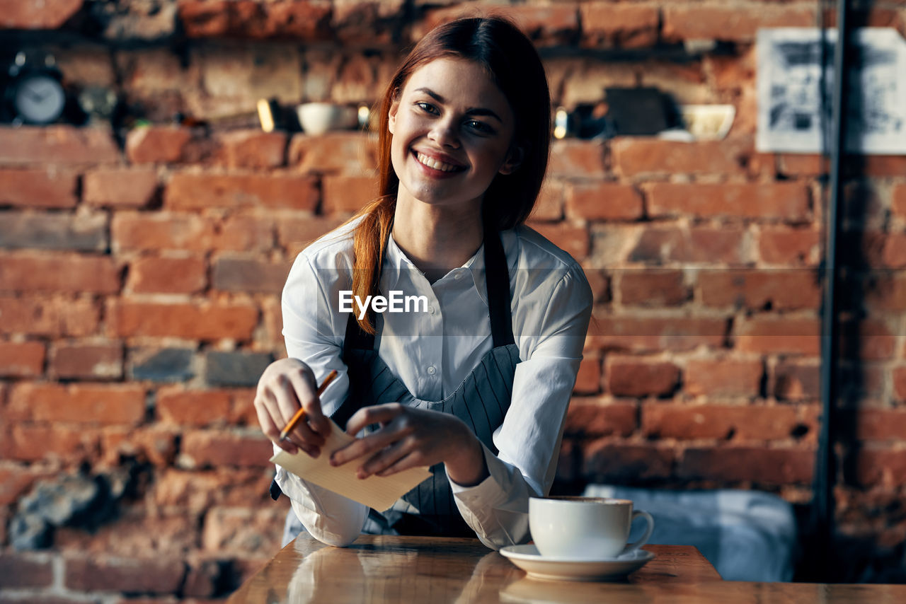 Portrait of woman with coffee