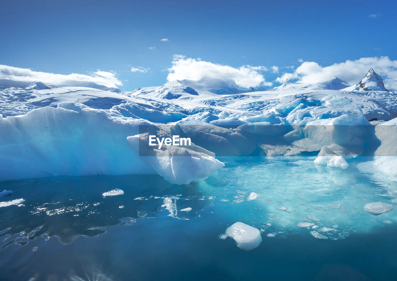 Aerial view of snowcapped mountains against sky