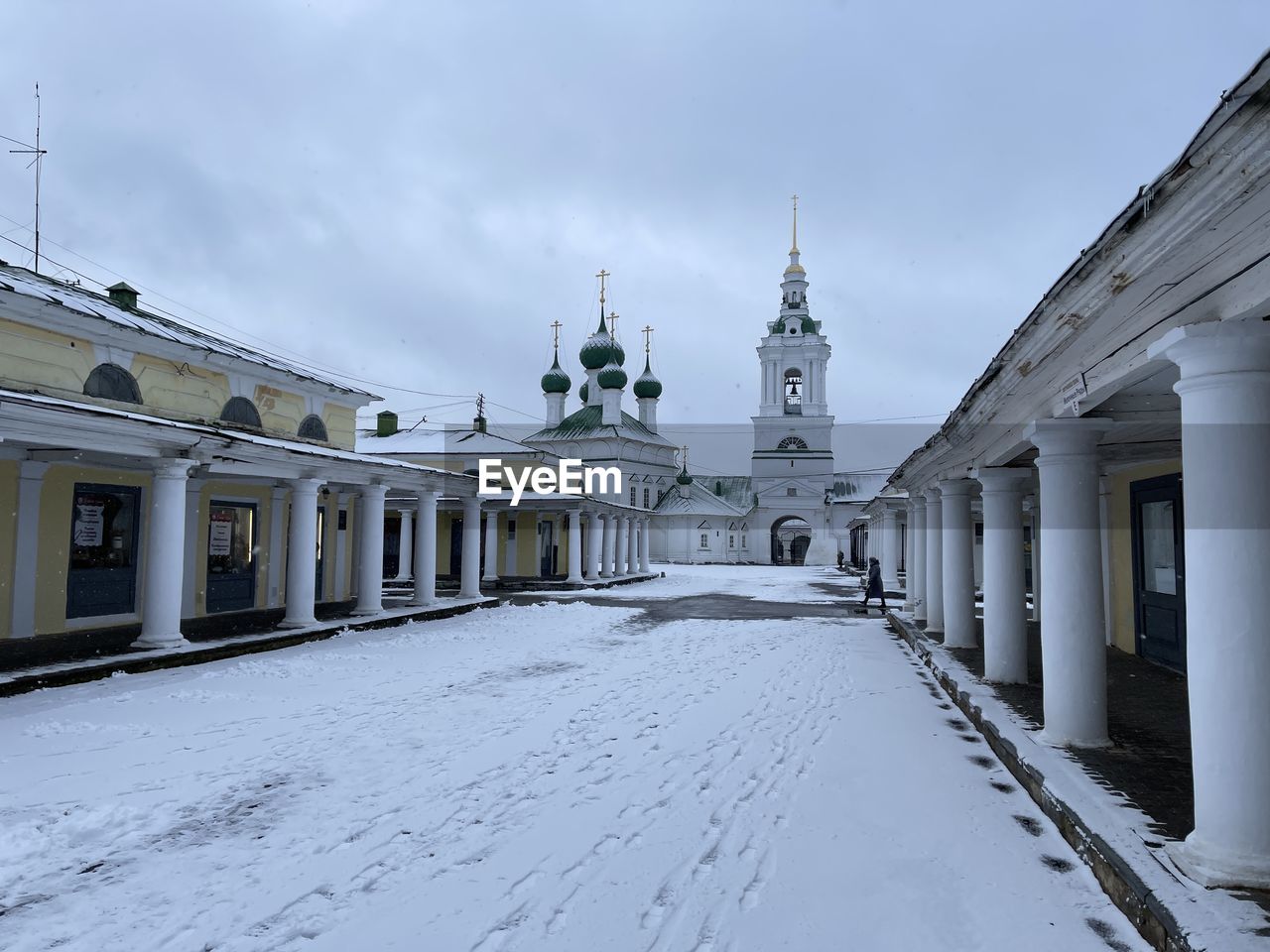 View of white building against sky during winter