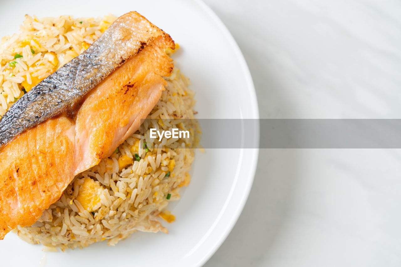 food and drink, food, healthy eating, fish, plate, wellbeing, freshness, meal, dish, vegetable, rice - food staple, no people, produce, indoors, breakfast, seafood, cuisine, vegetarian food, high angle view, gourmet, close-up, studio shot, dinner, risotto, lunch, asian food, bread