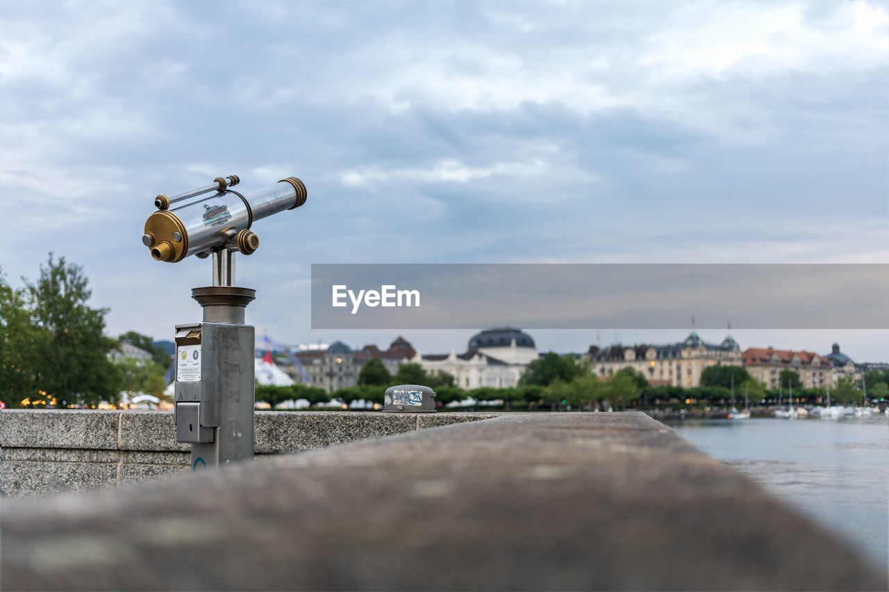 Tourist telescopes, observation binoculars overlooking the zurich lake, shallow depth of field