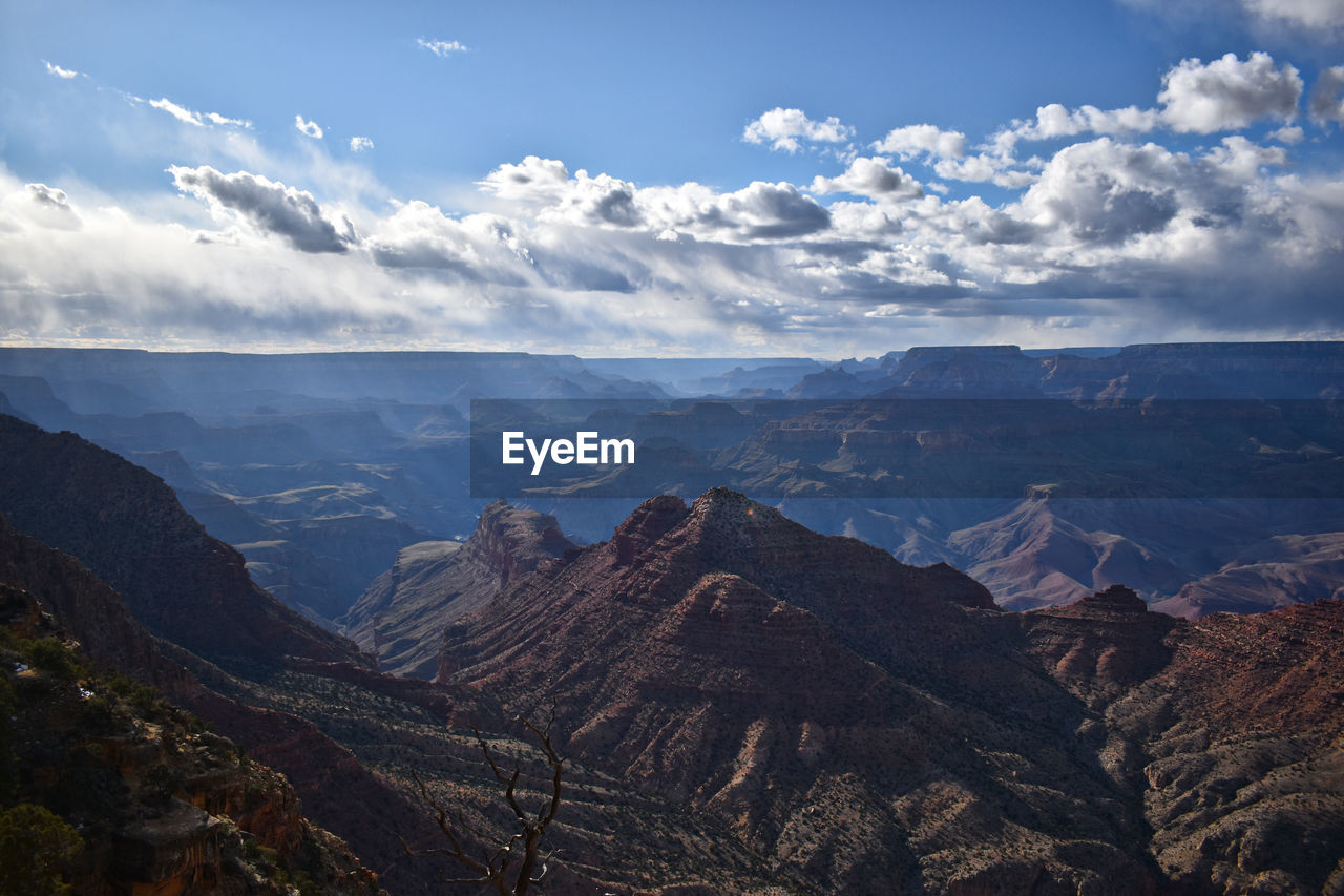 Scenic view of dramatic landscape against sky - at the grand canyon
