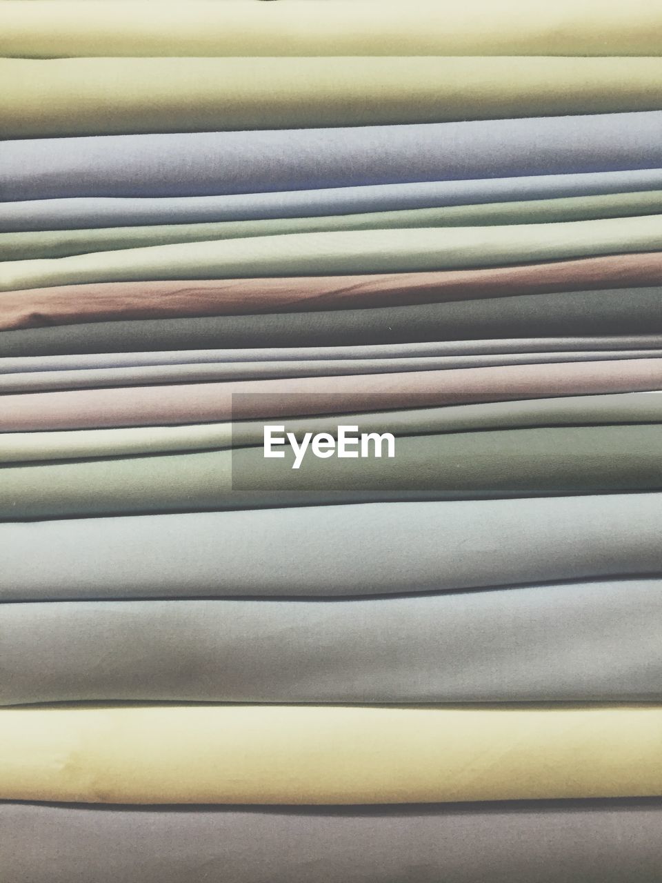 Full frame shot of multi colored stacked fabrics