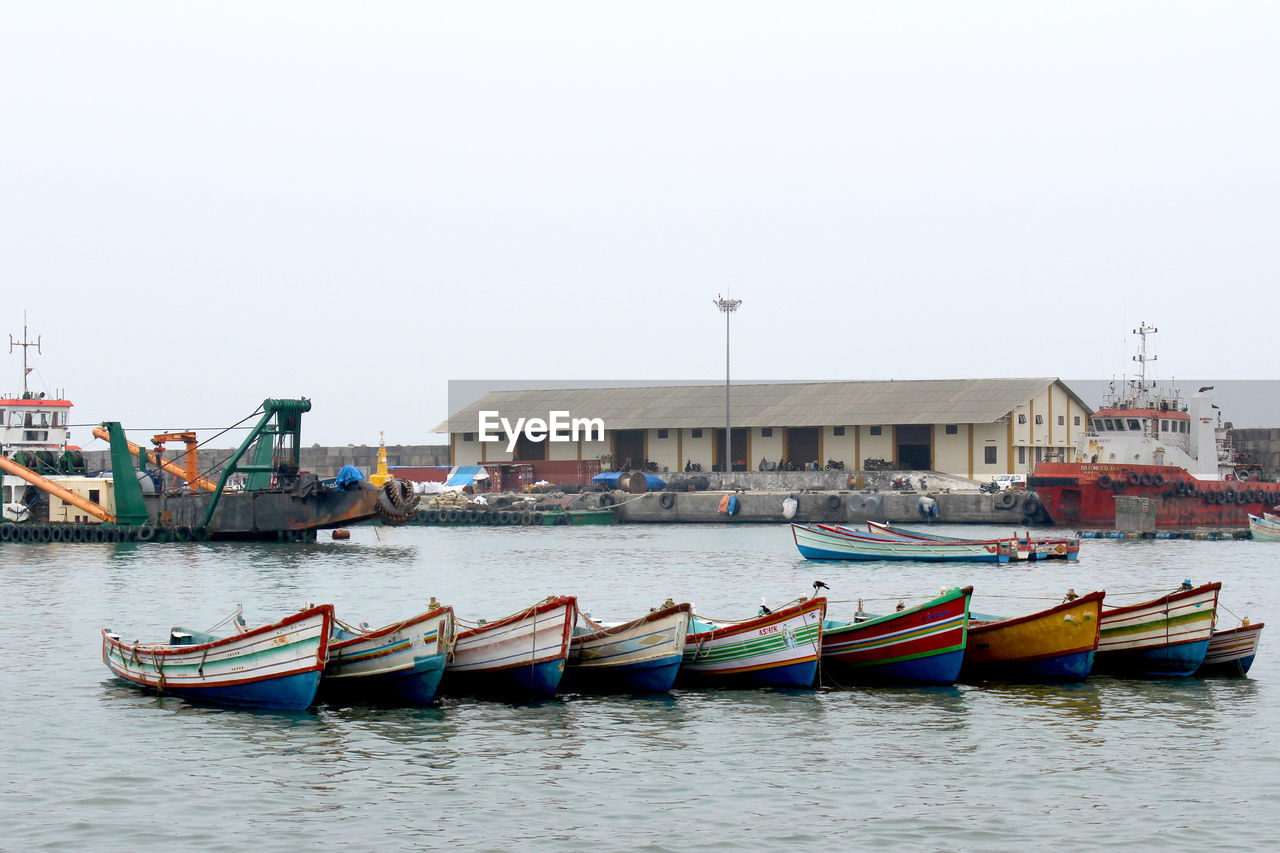 Boats moored in sea