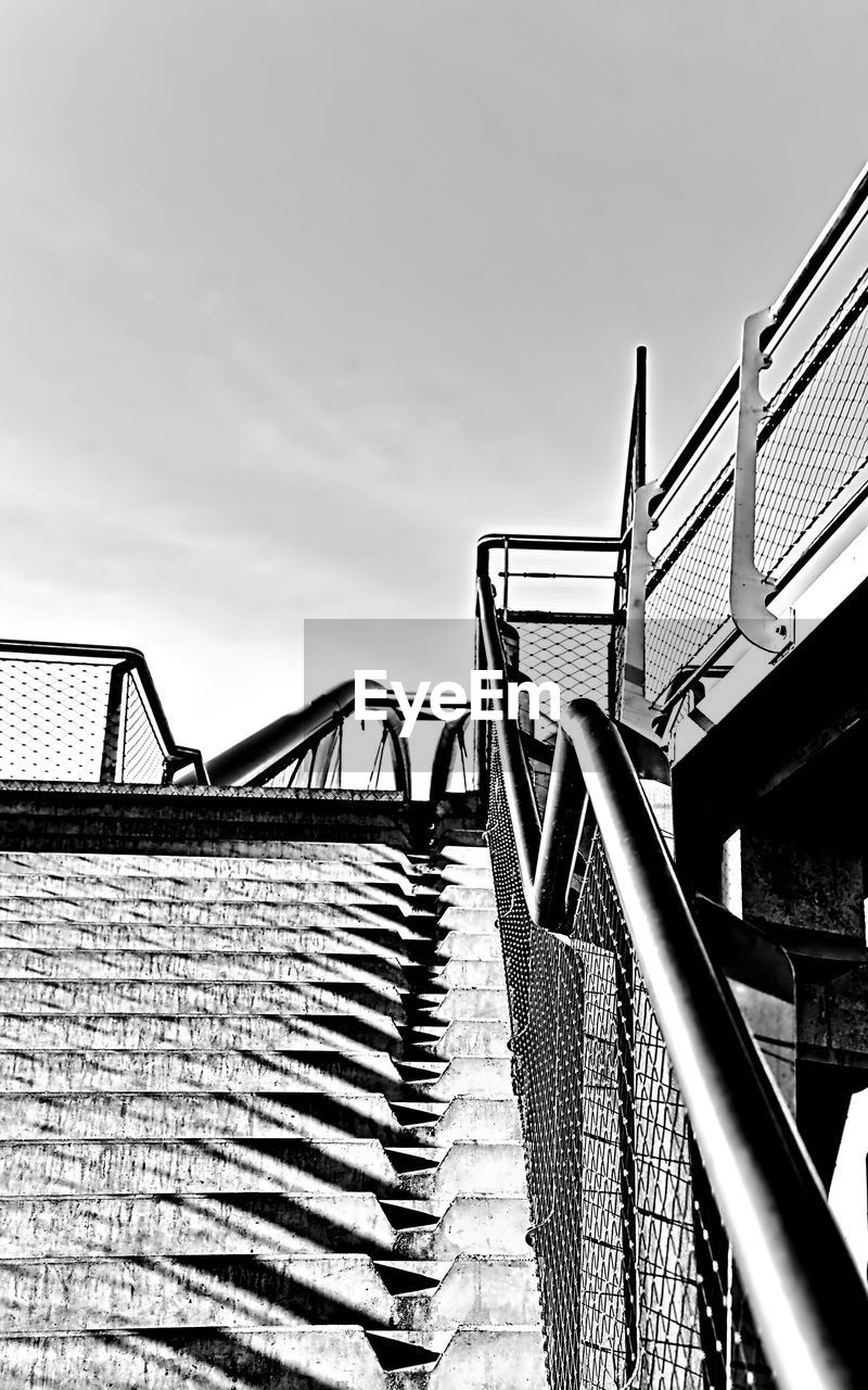 STAIRCASE AGAINST SKY IN CITY