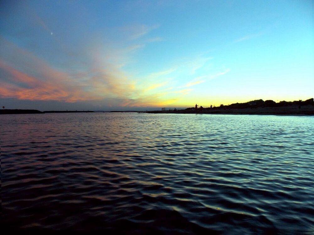 Scenic view of river against sky during dusk