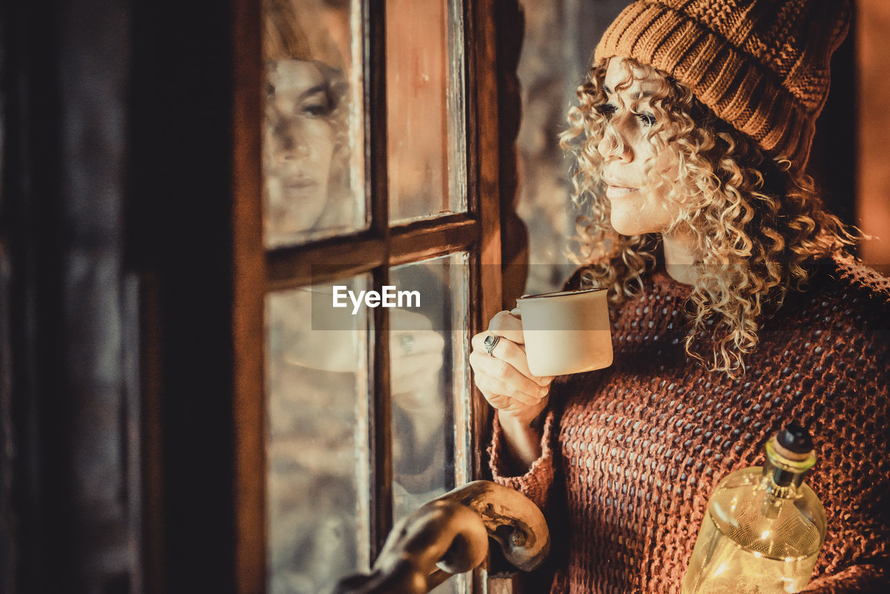 Close-up of coffee cup on window