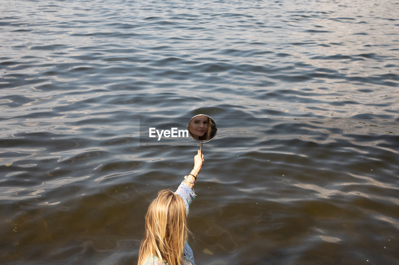 Portrait of woman in lake