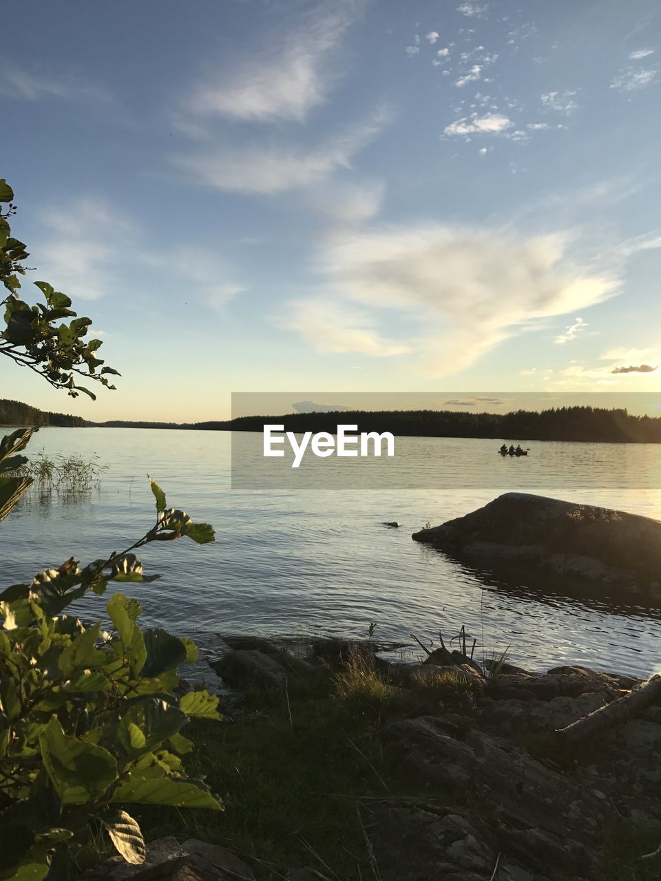 SCENIC VIEW OF LAKE AT SUNSET