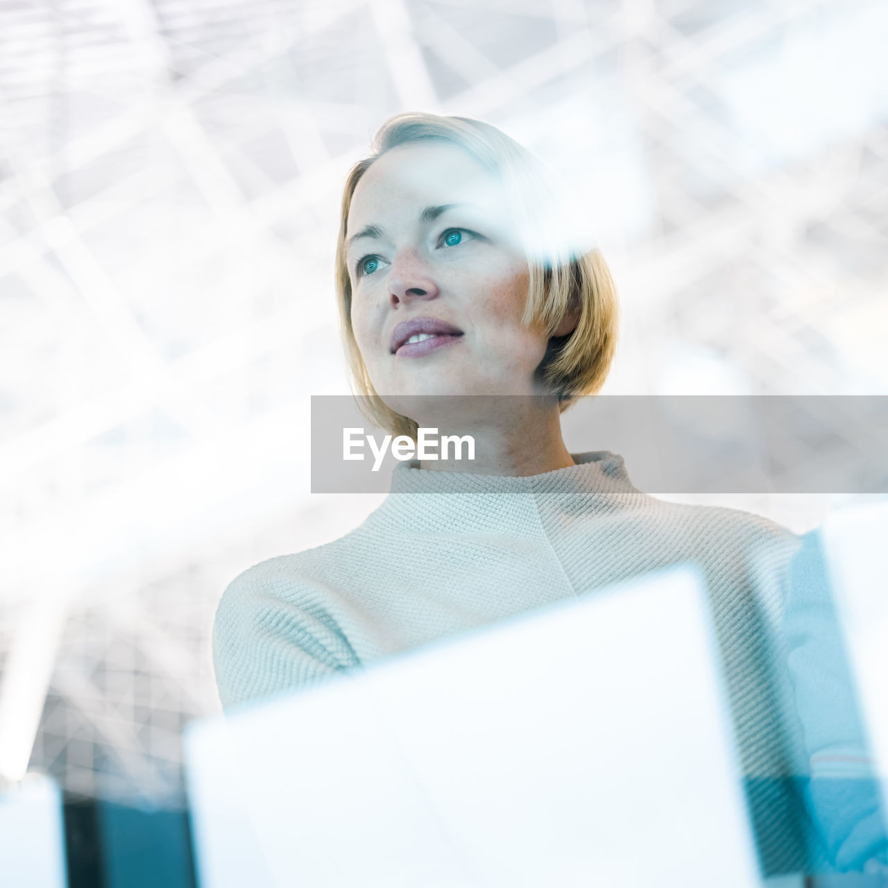 portrait of young businesswoman using laptop at office