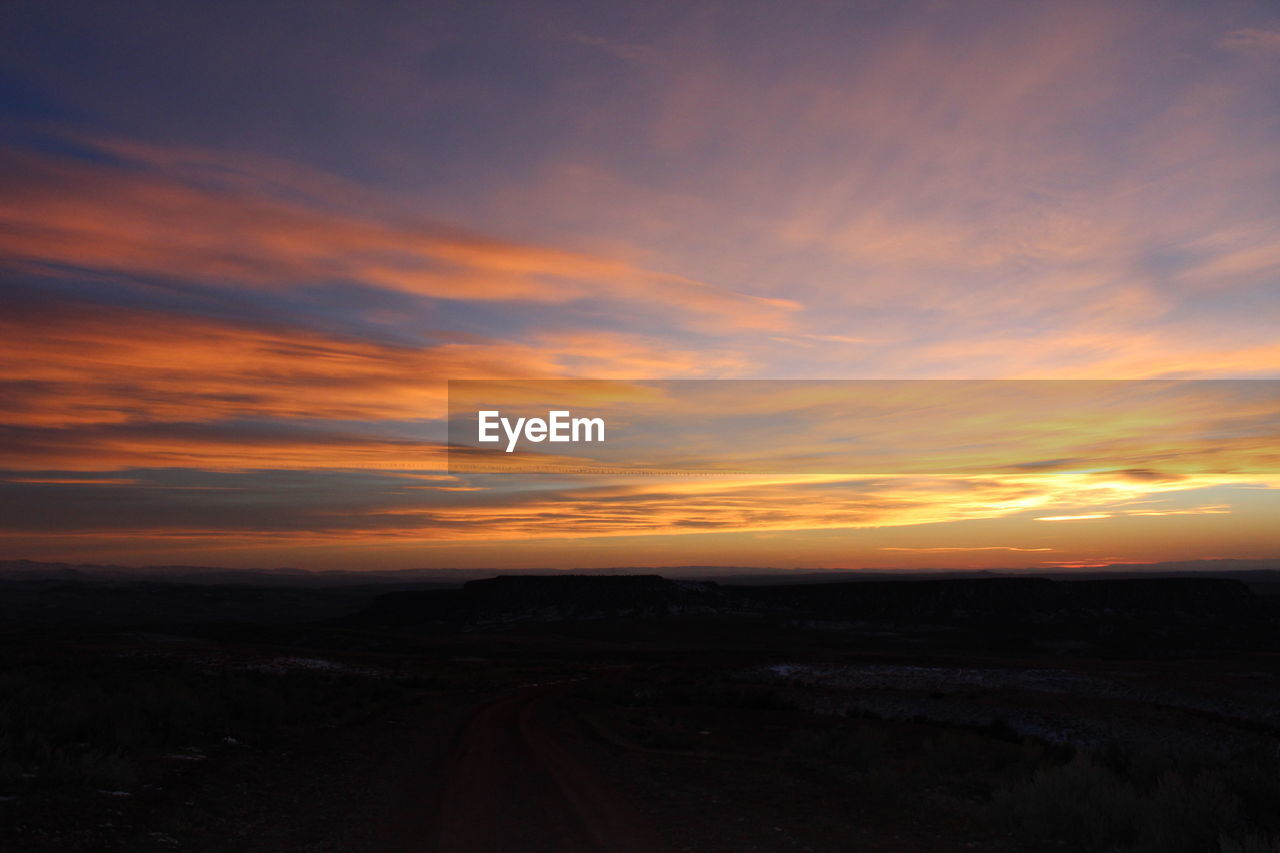 SCENIC VIEW OF SUNSET OVER LANDSCAPE