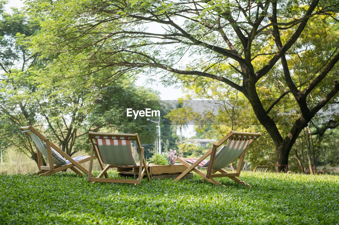 empty chairs on field in park