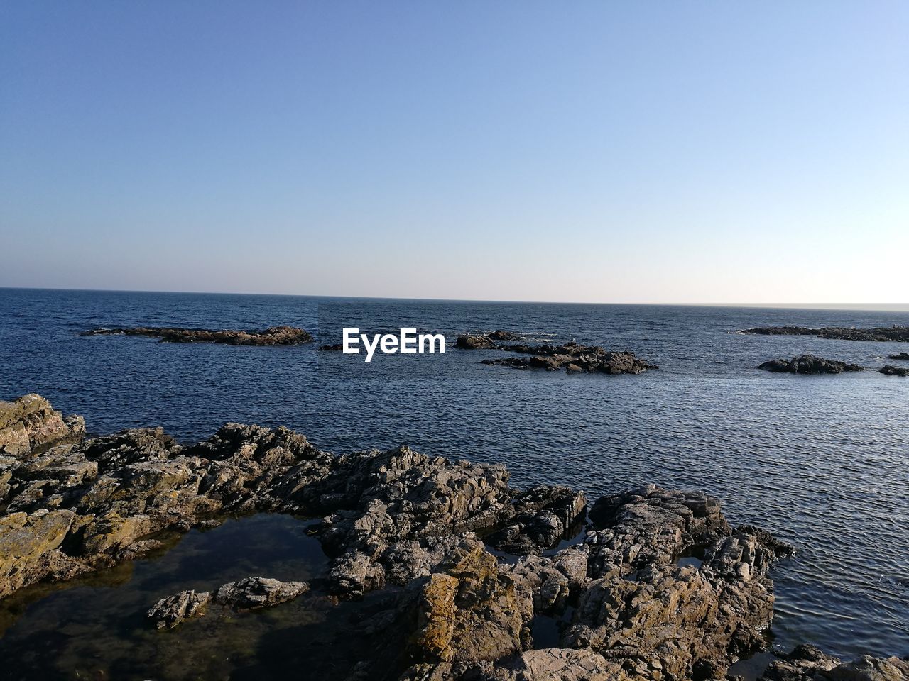 Scenic view of sea against clear sky