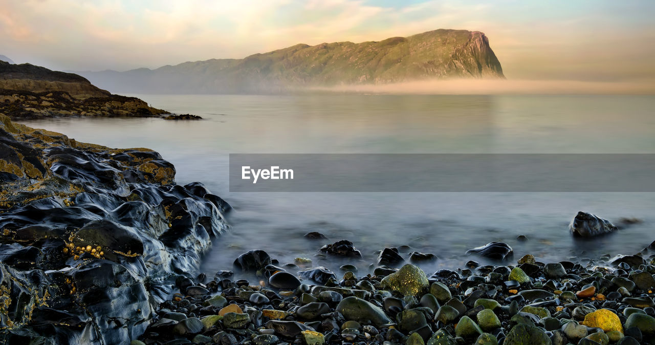 Scenic view of sea against sky during sunset